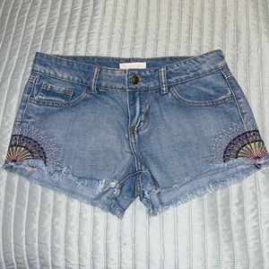 Others Follow Denim Cutoff Shorts with embroidered sun detail. Size 26